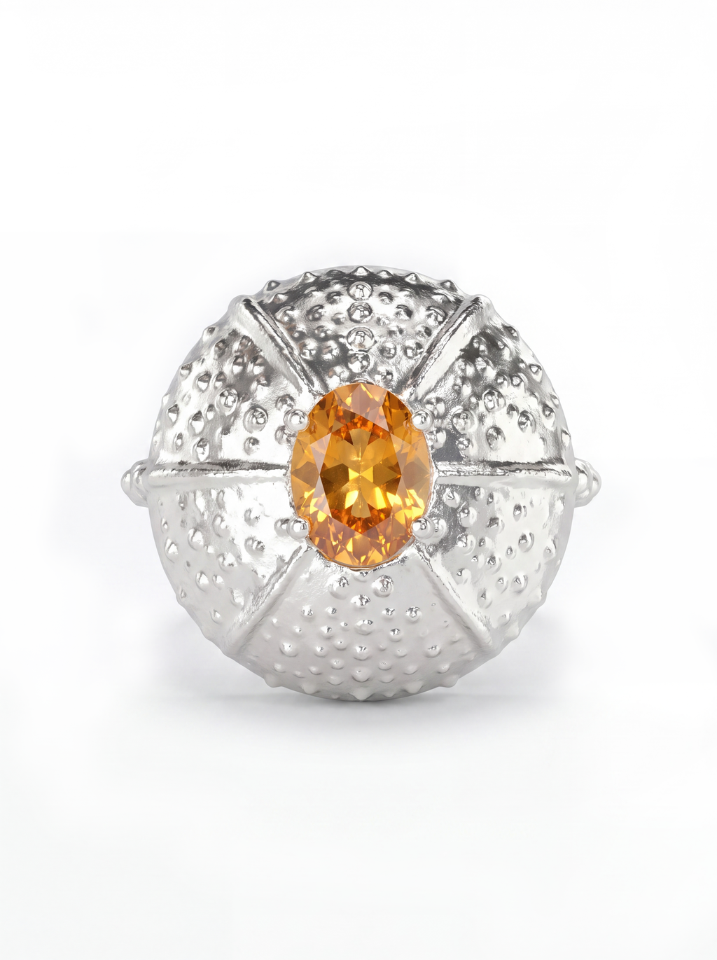 A white gold ring featuring a textured, sea urchin-inspired dome setting with a central oval orange sapphire, shown on a clean white background.