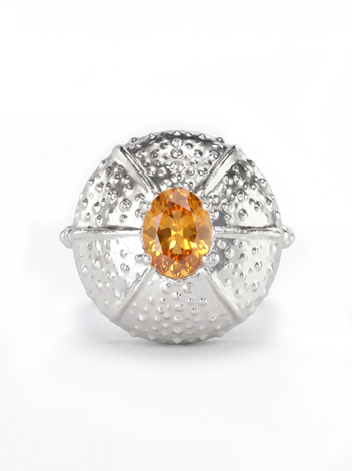 A white gold ring featuring a textured, sea urchin-inspired dome setting with a central oval orange sapphire, shown on a clean white background.